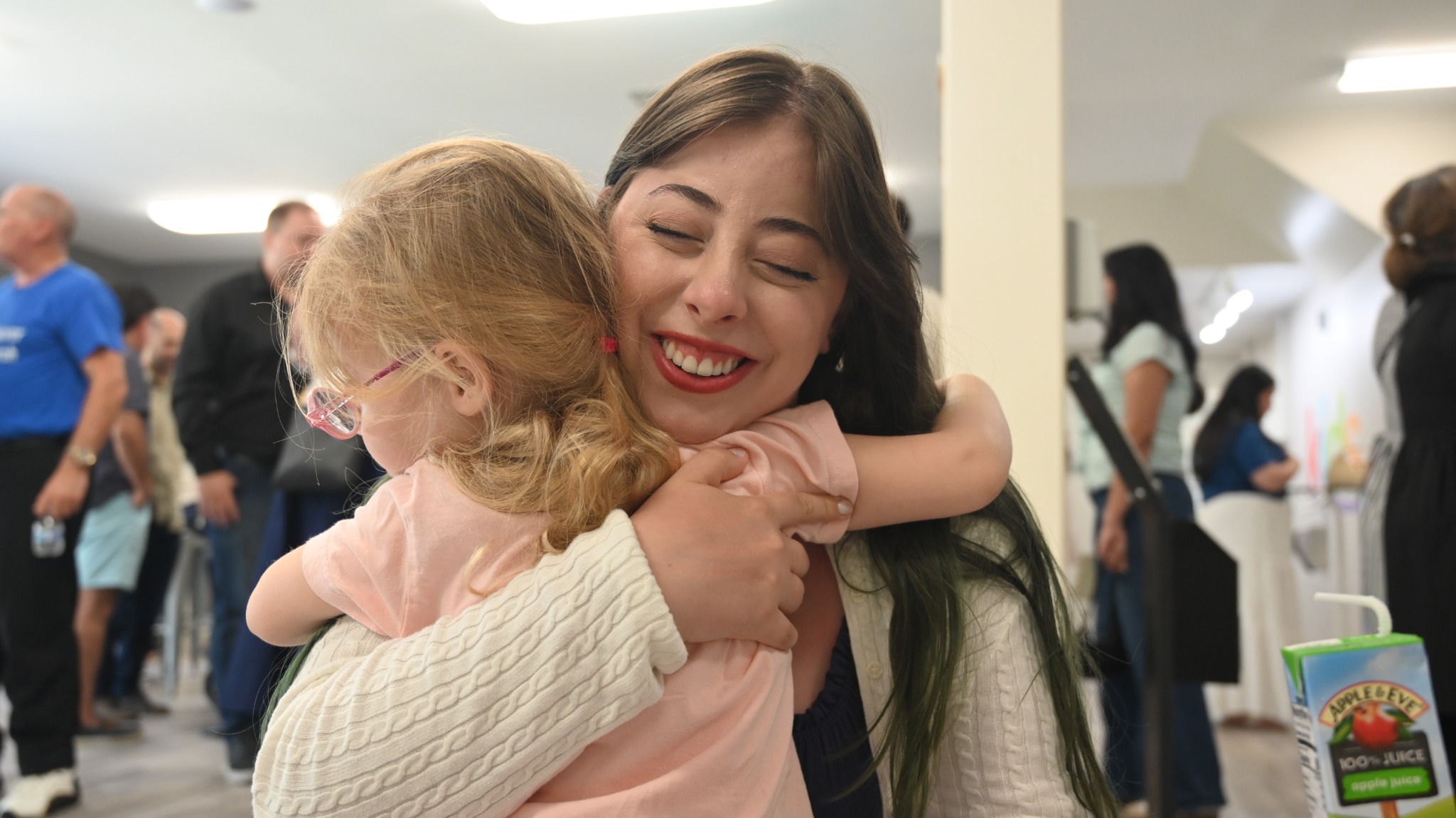 A child receiving a warm hug at church