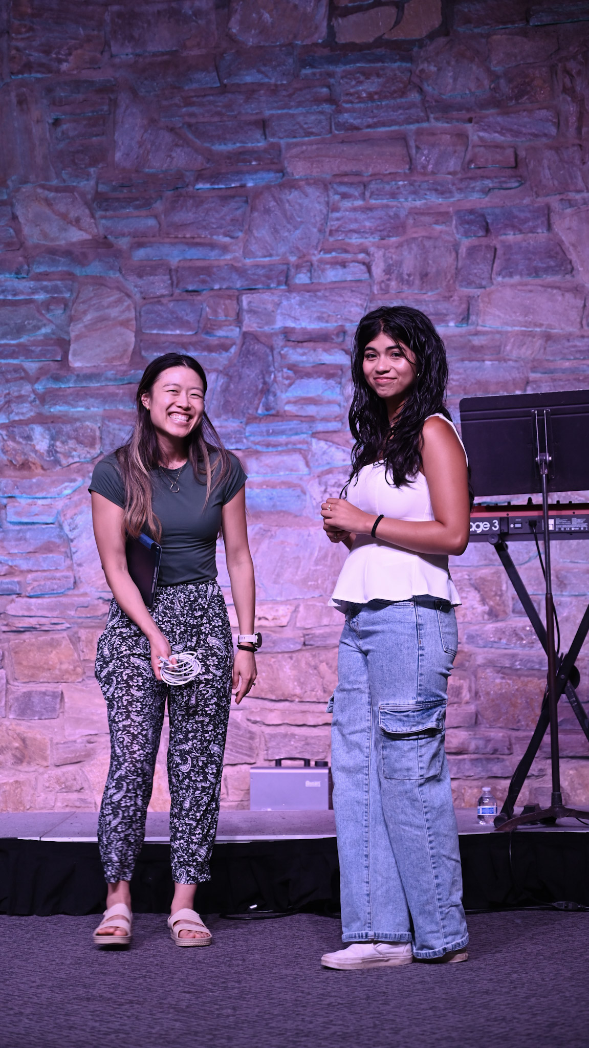 Two young adults smiling together at Broad River