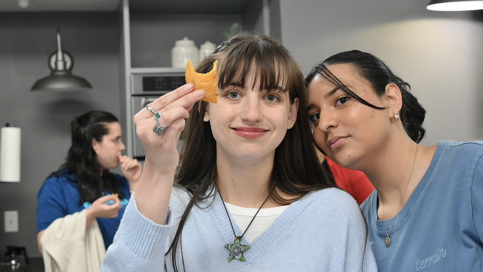 Two young adults enjoying food and time together at church