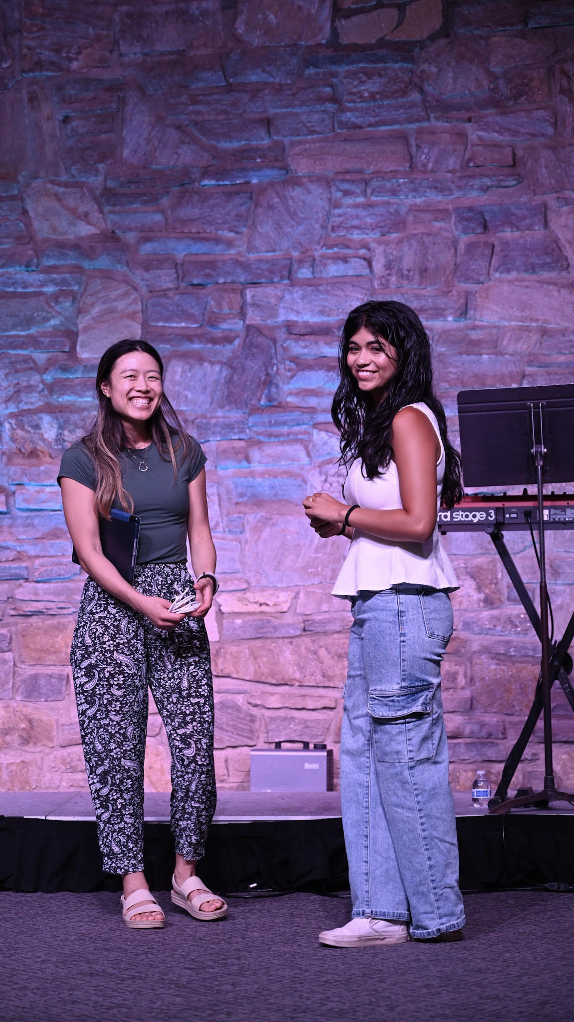 Two young adults smiling together at Broad River